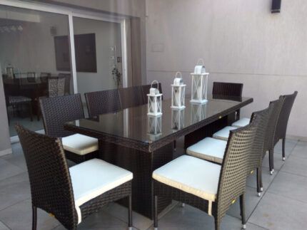 Juego de comedor Belmont de 11 piezas en ratán sintético para exteriores